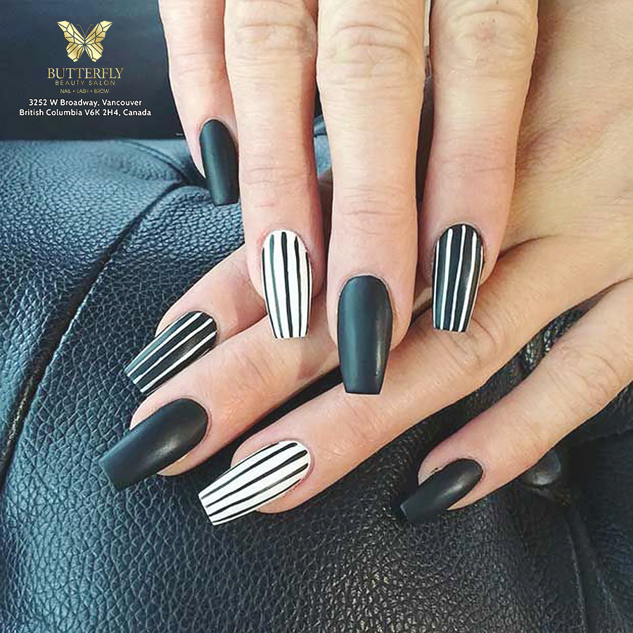 Matte black and striped nails